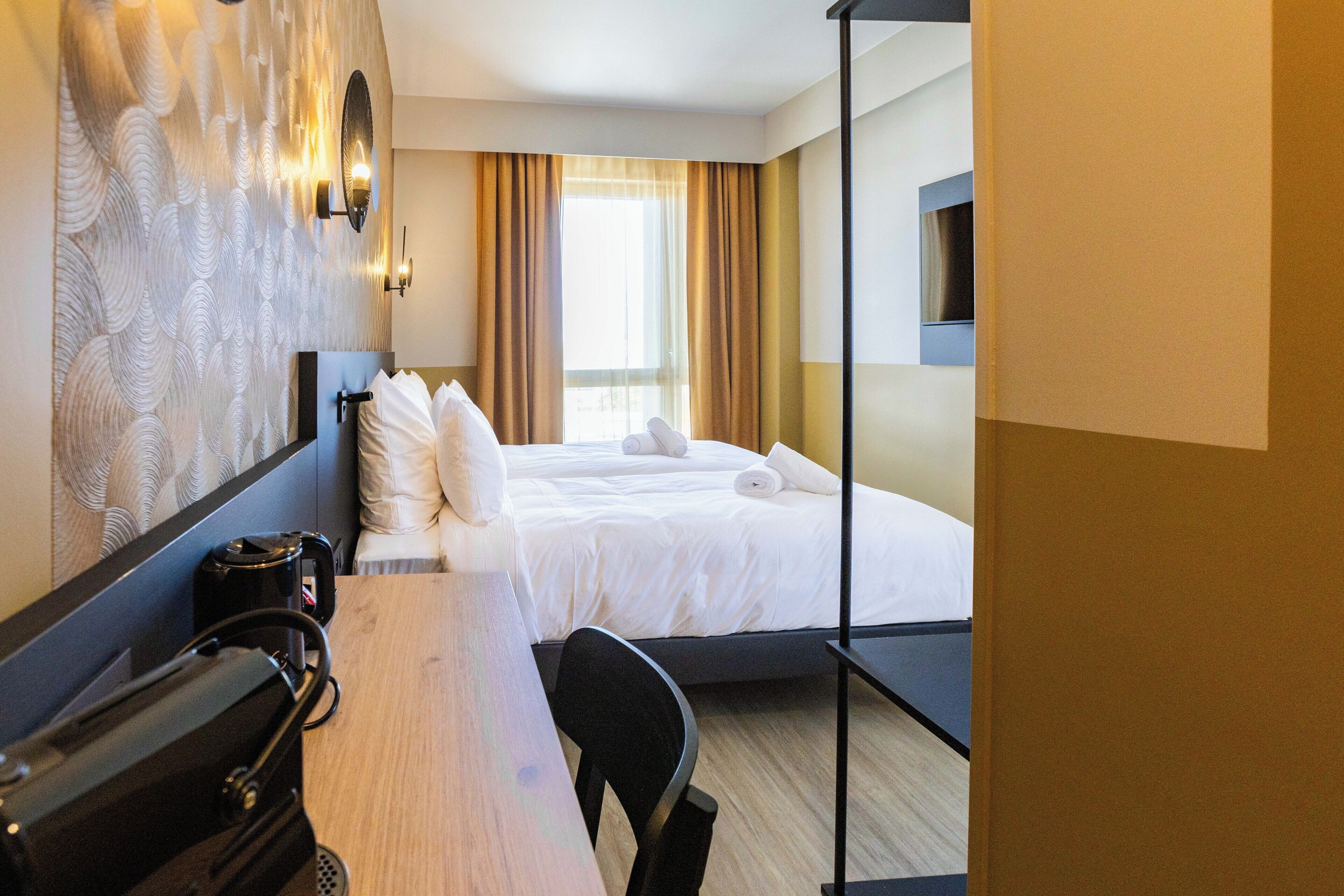 Habitación superior, 2 camas individuales | Insonorización, wifi gratis y ropa de cama 