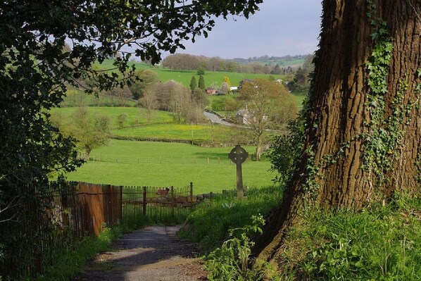 Escape to a serene countryside setting, surrounded by lush green landscapes and historic stone structures.