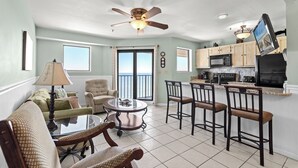 A spacious living room with a dining area, kitchen, and a balcony with a view. - Myrtle Beach Resort RT2111 (Myrtle Beach)
