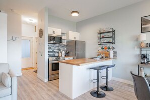 Fridge, oven, high chair, spices