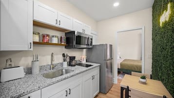 Fridge, microwave, stovetop, coffee/tea maker