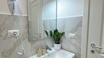 Hair dryer, bidet, towels, soap