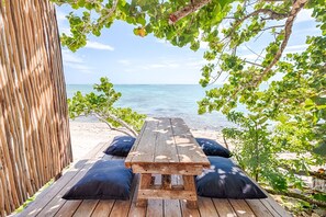 Outdoor dining - Beachfront Luxury Near Tulum, AC, Pool, 3 BR (Tulum)