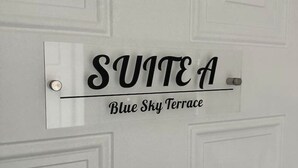 A sign on a door labeled "SUITE A Blue Sky Terrace". - Suite A at Blue Sky Terrace (Columbus)
