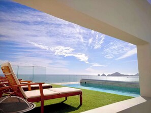 Pool - Rooftop Infinity Pool with Panoramic Arch Views • Stylish work-friendly Condo (Cabo San Lucas)