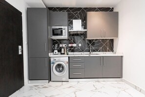 Fridge, microwave, stovetop, coffee/tea maker