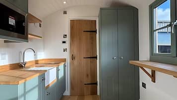Cabin | Private kitchen | Fridge, microwave, oven, stovetop