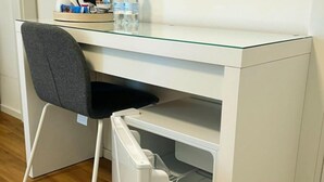 A compact workspace with a glass top desk, a chair, and a built-in mini-fridge. - Private Room 2, with S.Peter View (Irnerio) (Roma)