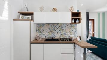 Fridge, microwave, stovetop, coffee/tea maker