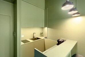 Fridge, microwave, stovetop, coffee/tea maker