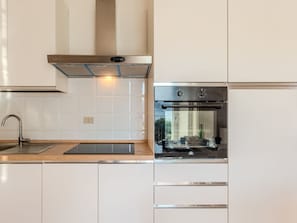 Fridge, oven, cookware/dishes/utensils