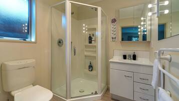 Shower, hair dryer, towels, toilet paper