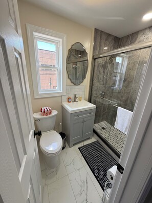 Shower, hair dryer, towels, soap
