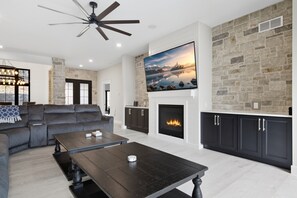 Smart TV, fireplace, table football, books