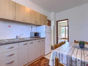 Fridge, microwave, cookware/dishes/utensils, dining tables - Apartment Zoki 1 by Interhome (Umag)