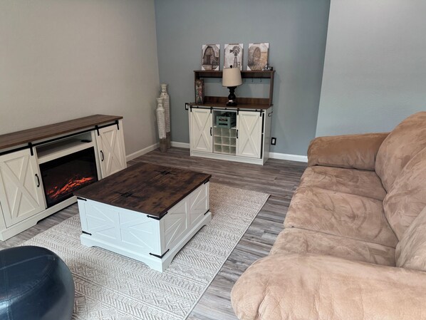 Smart TV, fireplace, books