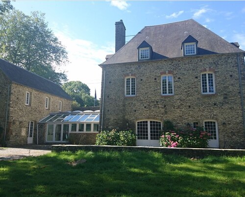 MOULIN DES RONDELLES. A 7-bedroom Historical Moulin in charming Cerisy-la-Forêt,