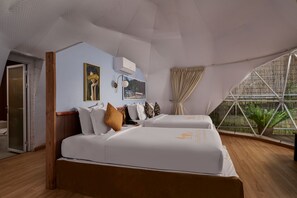 Luxe beddengoed, een minibar, een kluis op de kamer, een bureau