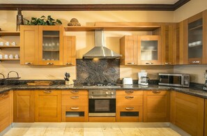 Fridge, microwave, stovetop, cookware/dishes/utensils