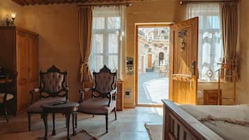 Deluxe Suite | Bathroom | Separate tub and shower, hair dryer, slippers, towels
