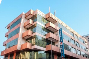 Experience the unique blend of glass and solid panels at the Phoenix Hotel, offering a variety of room layouts.