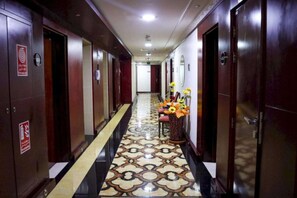 Stylish hotel corridor with polished floors and modern amenities.