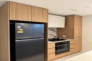 Fridge, microwave, oven, stovetop - Two-bedroom apartment in Canberra City (Dickson)