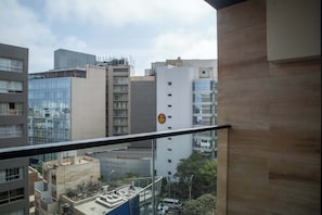 Experience the city from your balcony with a view of the surrounding urban landscape.