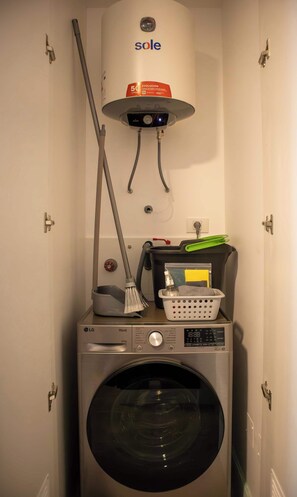Convenient laundry facilities feature a washing machine and water heater for efficient laundry tasks.