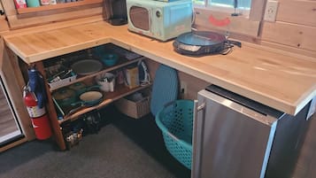 Fridge, microwave, coffee/tea maker, dining tables