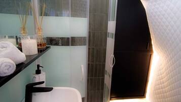 Shower, hair dryer, towels, soap