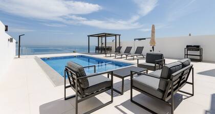 4BR Villa with Arabian Gulf, Mountain, Community Views and Heated Pool