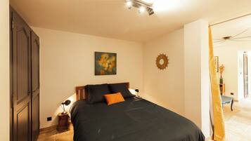 1 bedroom, desk, iron/ironing board, travel crib