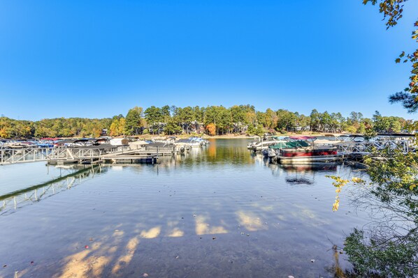 A marina with boats docked, surrounded by trees and a clear sky. - Boat, Golf & Swim: Keowee Key Condo w/ Lake Views (Salem)