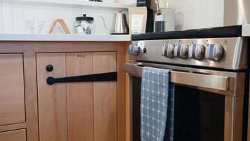 Fully stocked kitchen with custom craftsman cabinets.