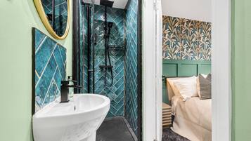 Shower, hair dryer, towels, shampoo