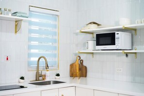 Fridge, microwave, stovetop, coffee/tea maker