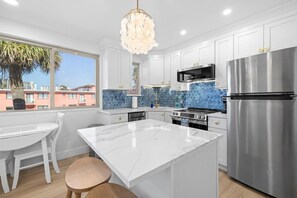 Fridge, microwave, oven, stovetop - Coastal Elegance Retreat | Gulf View, Heated Pool (St. Pete Beach)