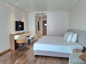 Deluxe Double Room | Living area | 51-inch Smart TV with cable channels, iPod dock - The Dome Grand (Duy Tien)