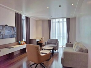 Classic Studio Suite | Living area | 51-inch Smart TV with cable channels, iPod dock - The Dome Grand (Duy Tien)