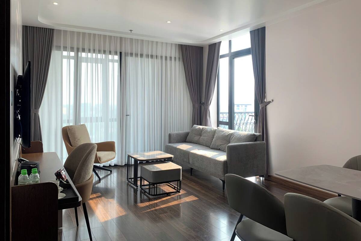 Family Suite, 2 Bedrooms | Living area | 51-inch Smart TV with cable channels