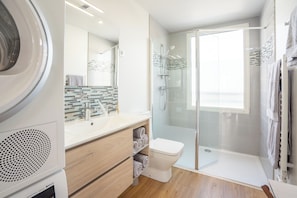 Shower, hair dryer, towels, toilet paper