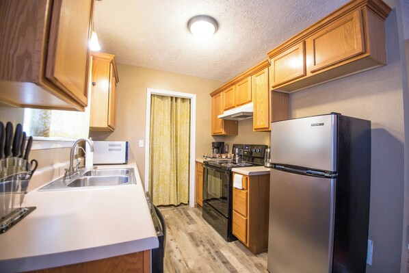 Fridge, microwave, oven, stovetop - Charming 3-bedroom home just of the Ozark square! (Ozark)
