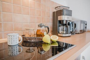 Microwave, stovetop, dishwasher, coffee/tea maker