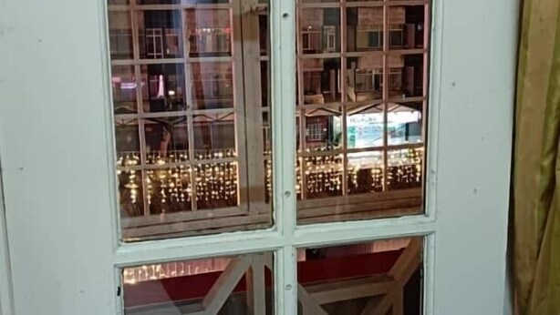 A white door with multiple glass panels and a metal frame. - cool memories hotel  (Tanah Rata)