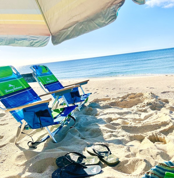 On the beach, sun-loungers, beach towels