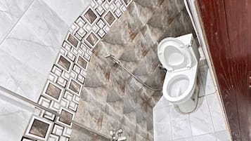 Shower, towels, soap, toilet paper