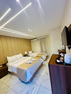 In-room safe, laptop workspace, blackout drapes, soundproofing