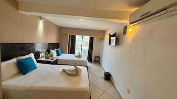 Suite Deluxe, 2 camas Queen size, balcón, vista a la ciudad | 1 habitación y wifi gratis