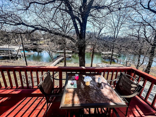 Enjoy a serene lakeside retreat with a deck overlooking the water.